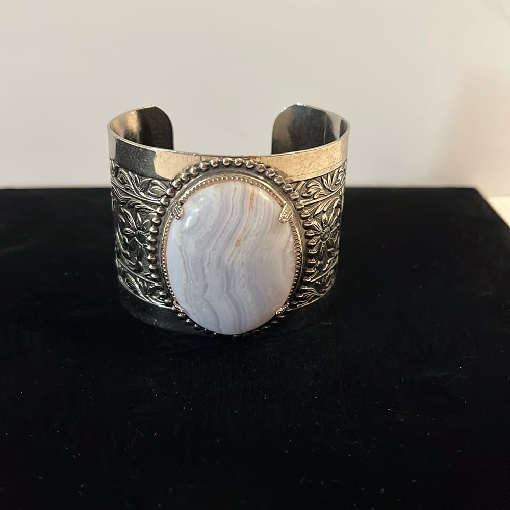 Silver tone Cuff Bracelet with scroll design and stone with bezel settings.